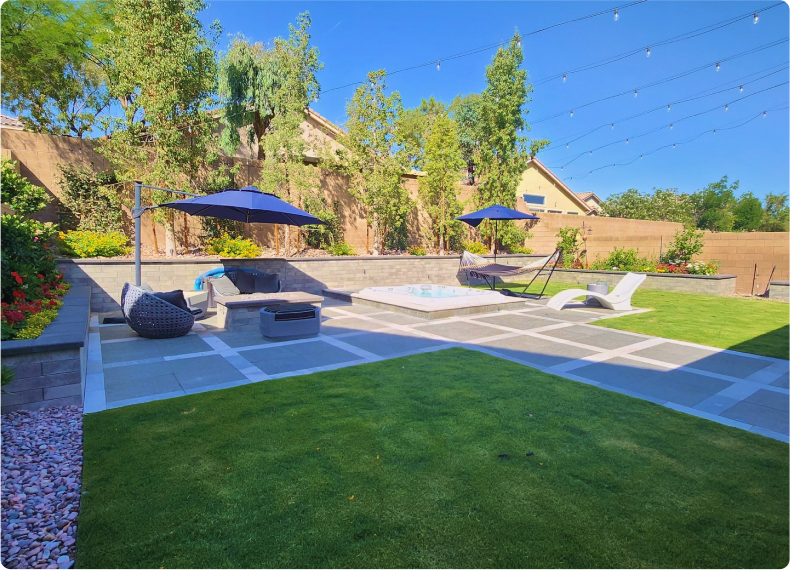 A patio with lawn chairs and umbrellas in the background.