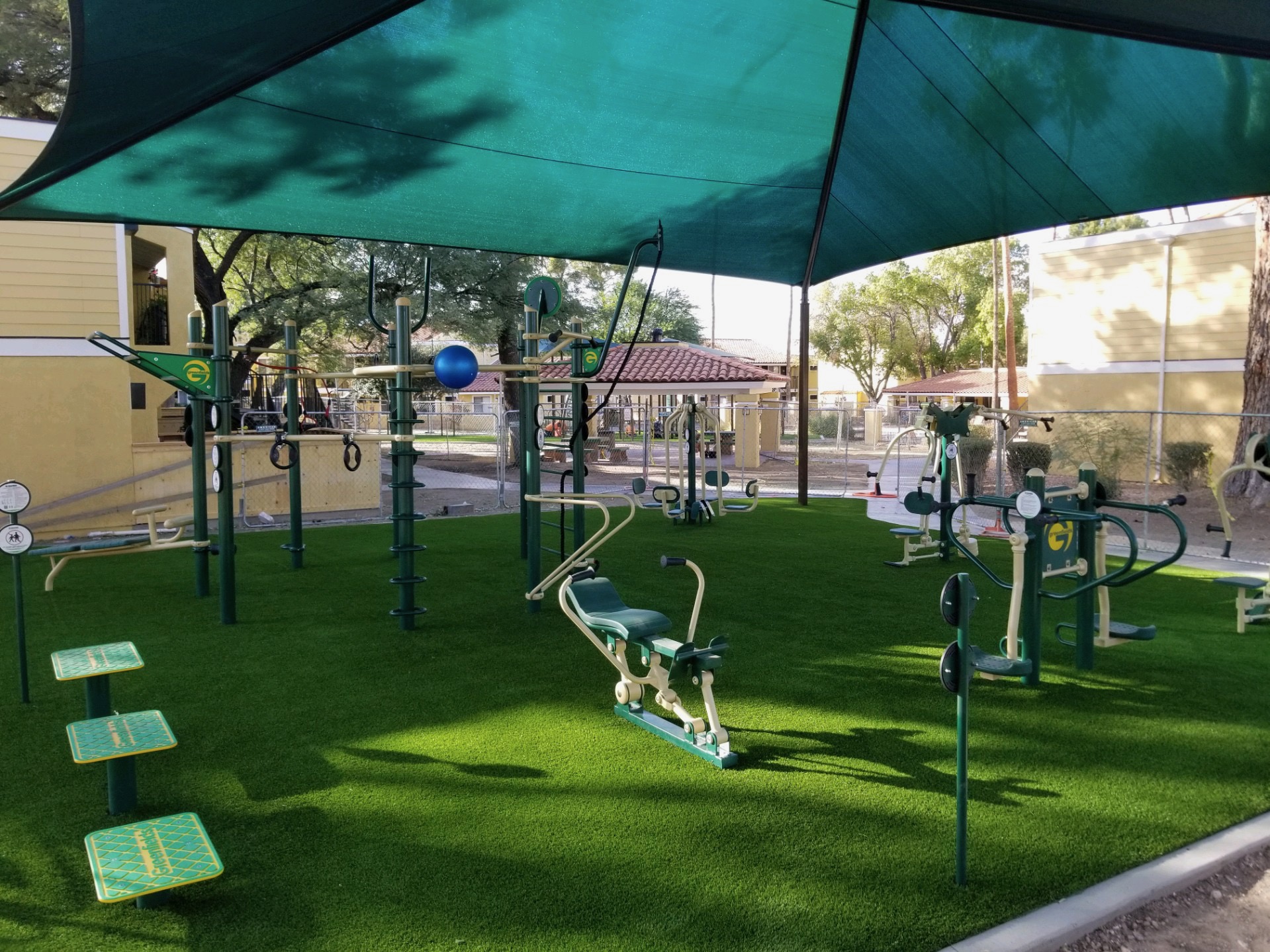 A playground with slides and swings for children.